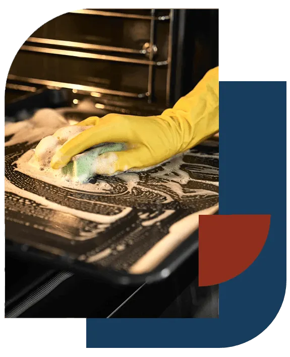 Gloved hand scrubbing an oven rack during a deep cleaning in New Orleans