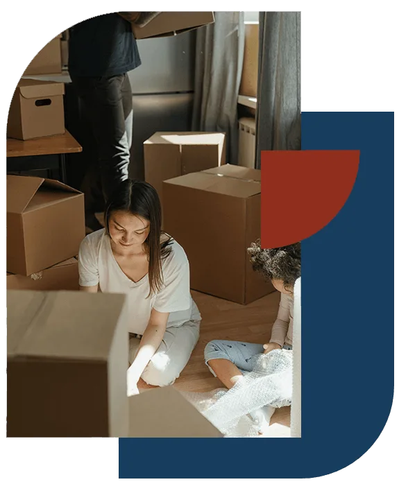 Family unpacking boxes after a move out cleaning in New Orleans